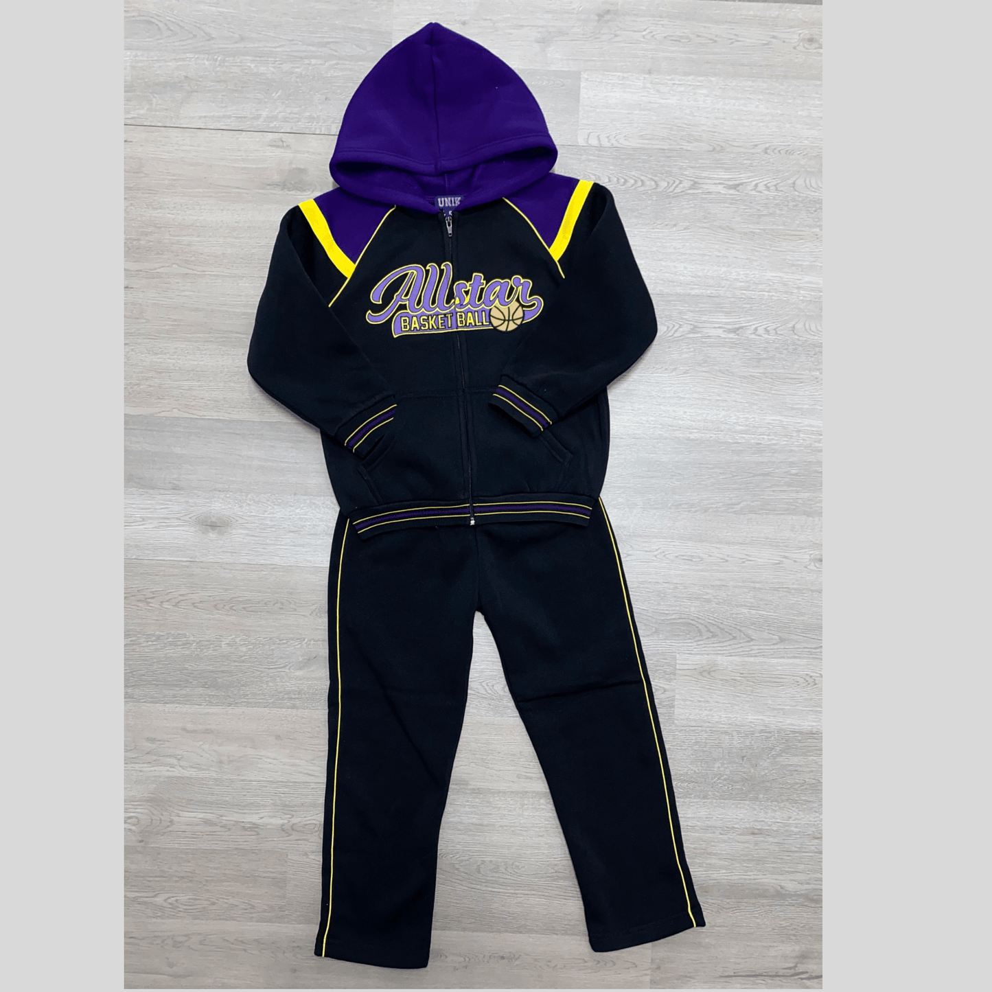 Keep your All-Star feeling and looking like an All-Star in this warm fleece sweat suit. This black sweat suit features the words "All-Star" and a basketball embroidered on the front. This sweat suit is perfect for the little baller in your life.