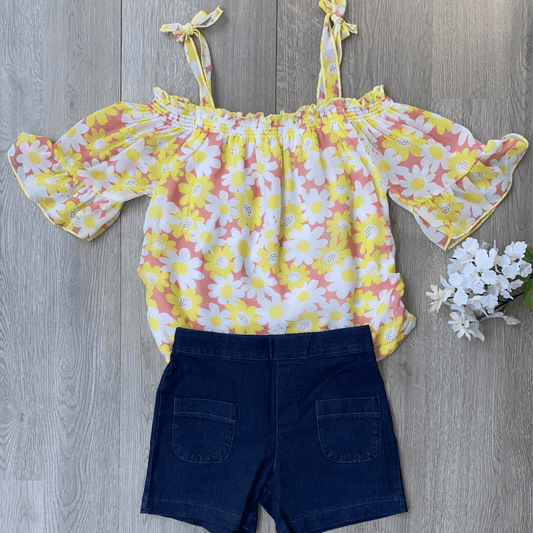 Be summer ready with this cute 2 piece short set featuring an off the shoulder, light weight blouse.  This coral flowered short set is the perfect for a stylish and comfortable look while playing outside in the summer heat.
