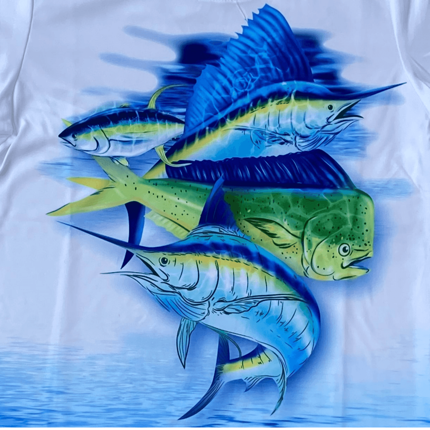 Make a splash with this long sleeve, crew neck T-shirt. This performance tee features a bright blue swordfish design and a blue water print pattern on the sleeves. This long sleeve tee is a perfect way to reminisce about summer days as we go into the fall season.