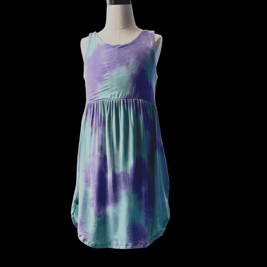 This comfortable, lavender and mint dress is perfect for a day of summer fun.  This dress features hidden pockets that your little one can use to store all of her treasures after her day of adventure and fun!