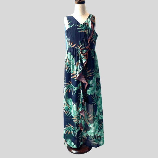 A gorgeous tropical print maxi dress made especially for this summer season!  Comes in a unique sleeveless silhouette with a bold cascading ruffle detail.  Back includes exposed zipper.  Soft knit lining also included for her comfort.