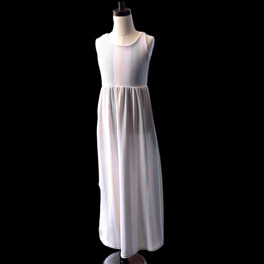 This comfortable waffle fabric striped dress is perfect for the summer.  This sleeveless dress has neutral toned taupe stripes to keep your little one cool in the heat.  The hidden pockets are perfect to hold any treats that your little one needs for her day of exploration and fun.