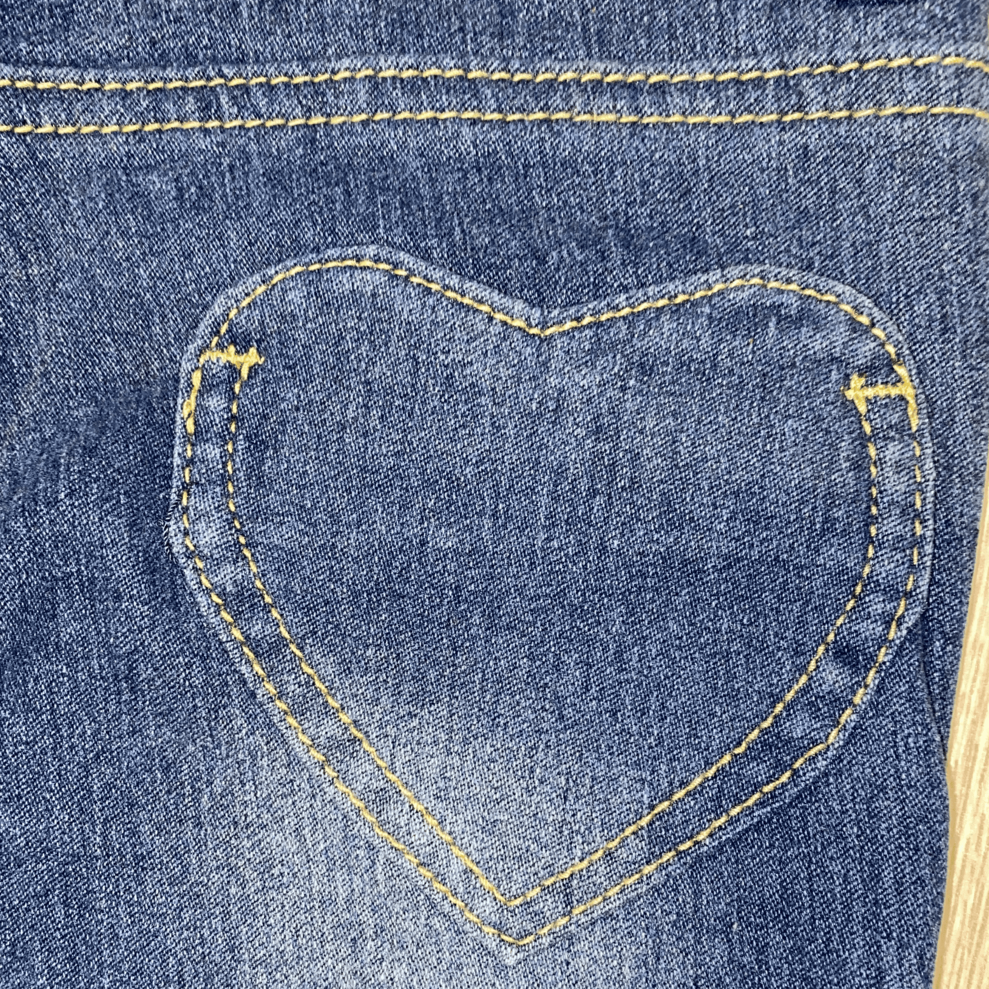 The heart-shaped back pockets of our distressed jeans.