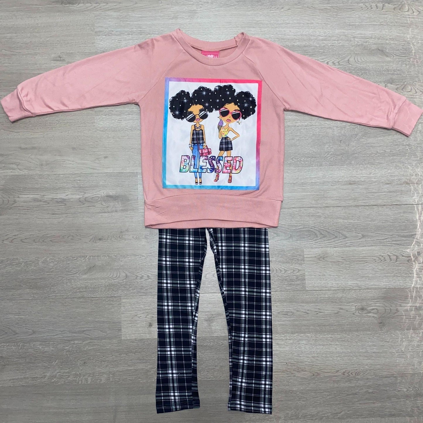 Get ready for fall in this cozy legging set.  This set features a dusty rose colored top with a screen pressed "Blessed" design and black and white plaid leggings.