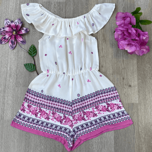 This romper is perfect for a hot, summer day.  With this light weight, white, ruffled peasant neck romper in woven Moroccan crepe with pink border your fashionista will be the most stylish girl around.